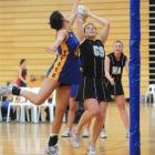 Phys Ed A goal keep Sam Stewart tries to block a shot from Sourthern A goal shoot Katie Shearer...