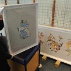 Pictorial collections curator Natalie Poland displays one of Kushana Bush's works ahead of her...