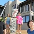 Pictured outside their leaky Glenleith home last February are  (from left) Michael Beazley,...