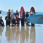 Pictured with Cameron Johnston (front) are surf instructor Steve Newton and pupils (standing from...