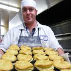Pastry chef Bernard Kirkpatrick, of Roxburgh, takes another tray of pies out of the oven at Jimmy...