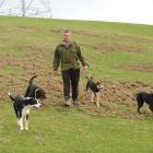Pig hunter Kim Hiko and his dogs (from left) Charlie, Moi, Jud, Chook and Nig walk through...