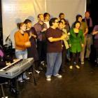 Pip Walls (right) conducts the cast of Das Roq Opera during a rehearsal at the Globe Theatre....