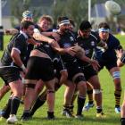 Pirates lock Jarred Williams pops the ball free from a lineout drive for halfback Ben West during...
