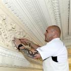 Plasterer Dave Wenlock works restoring the plasterwork at the new Duke of Wellington premises in...