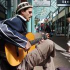 Aram Spruit, of Spain, busks in Albion Ln to help fund his travels through New Zealand.  Photo by...