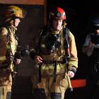 Police and the Fire Service attend a  fire at a Crichton St, Wakari, property last night. Photo...