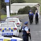 Police arrest a Black Power Mangu Kaha gang member in Dunedin yesterday, following a drive-by...