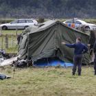 Police at the scene of the September 2010 Fox Glacier plane crash which killed nine people. Photo...