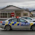 Police attend the scene of a car crash in Balclutha yesterday.  Photo by Hamish MacLean.