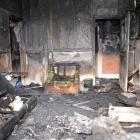 Police believe the fire that destroyed this lounge in a South Dunedin house was deliberately set....