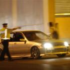 Police check a boy racer's car in Filleul St, Dunedin. File photo by Craig Baxter.
