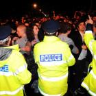 Police face off against the crowd in Castle St. Photo by Craig Baxter