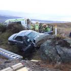 Police, firefighters and medical staff at the scene of a serious crash near Alexandra on Saturday...