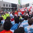 Police keep chanting English and Argentinian fans separate in Dunedin's Octagon before the teams'...
