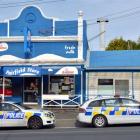 Police outside Fairfield Store and Takeaways in Dunedin yesterday. Photo by Gerard O'Brien.