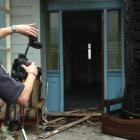 Police photographer Constable Eddie Fields records the scene at a Northumberland St property...