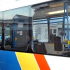 Police talk to the driver of a passenger bus that was allegedly shot at yesterday morning.  Photo...