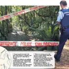 Police tape off areas around the entranceways to Ross Creek tracks yesterday after a woman was...