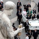 Pope Benedict XVI waves as he leaves at the end of a mass marking the opening of the Synod of...
