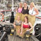 Posing for a charity calendar of Queenstown Volunteer Fire Brigade Firefighters (back, from left)...