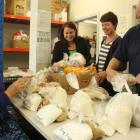 Preparing food parcels for the Salvation Army food bank are ...