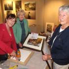 Preparing some of the hundreds of artworks for display at the 28th Arrowtown Autumn Festival Art...