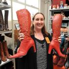 Presbyterian Support Otago retail assistant Donna Knox holds some red size-10 boots in the annual...