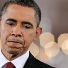 President Barack Obama listens to a question during a news conference in the East Room of the...