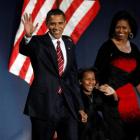 President-elect Barack Obama, his wife Michelle and daughter Sasha, 7, wave as they take the...