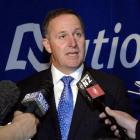 Prime Minister John Key fields questions from media after the National Party Mainland Region...