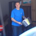 Prime Minister John Key sorts through his garage yesterday ahead of entertaining guests after...