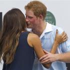 Prince Harry greets Brazilian model Fernanda Motta after a charity polo match in Campinas as part...