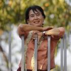 Pro-democracy leader Aung San Suu Kyi smiles at supporters as she celebrates  Burma's  New Year...