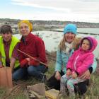 Project co organiser Zuni Steer (left) helps  Oamaru family,  Winsome White, daughter Bron and...