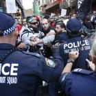 Protesters clash with police on a street in Sydney's central business district last Saturday. ...