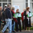 Protesters gather outside today's Southern DHB meeting at Wakari Hospital. Photo: Peter McIntosh