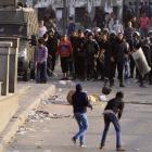 Protesters opposing Egyptian President Mohamed Mursi's rule are seen during clashes with riot...