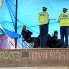Protesters talk to police in the Octagon yesterday morning. Photo by Stephen Jaquiery.