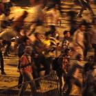 Protesters throw stones during a clash between supporters and opponents of ousted Egyptian...