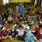 Pupils and staff at Anderson's Bay School celebrate caretaker Miguel Rodriguez's 20 years of...