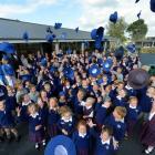 Pupils at St Mary's School in Mosgiel celebrate the start of the 2013 school year at their new...