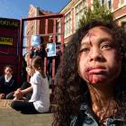 Otago Girls’ High School pupil Veronique Montalba (13) wears special effects make›up to protest...
