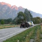 One of two traction engines that may have been responsible for a chain of fires is escorted by...