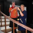 QLDC councillor Cath Gilmour and ball organiser Michelle Trapski propose a toast in the memorial...