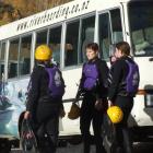 Survivors of yesterday’s ill-fated Mad Dog River Boarding trip gather beside the company minibus....