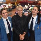 Queen's High School year 13 pupils Anastasia Manza (left) and Grace Parkes with principal Di...
