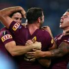 Queensland players celebrate their win over New South Wales. Photo Getty