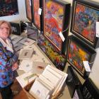 Queenstown abstract expressionist artist and art consultant Helga Coolman with some of the 100...
