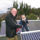 Queenstown Lakes Mayor Clive Geddes tries to cut a ribbon to a new solar heating initiative...